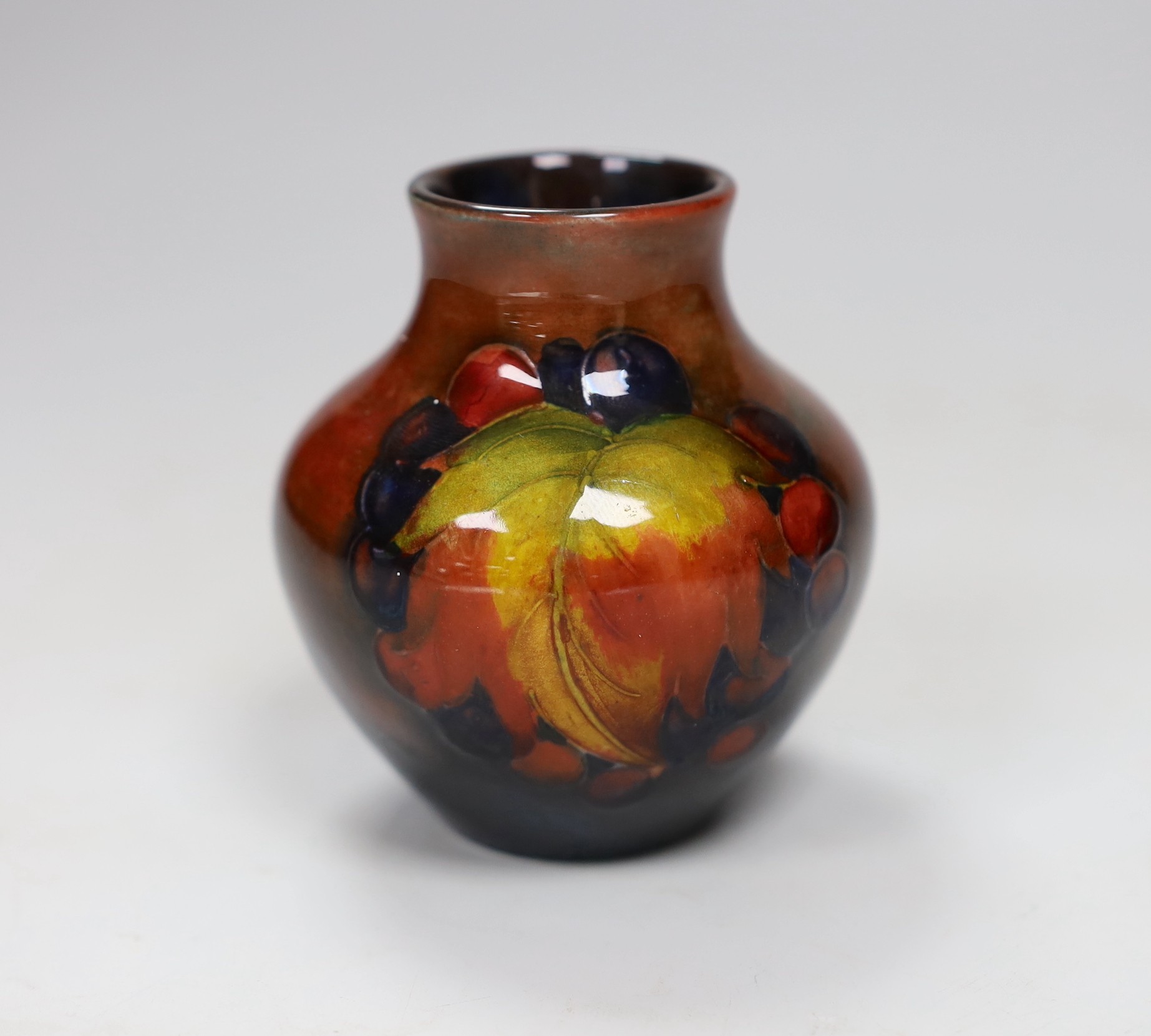 A Moorcroft flambé leaf and berry vase, 8cm